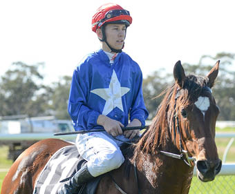 Harry Grace returns to the mounting yard on Birdies Galore after winning the We Thank Lions Club Maiden Plate at Warracknabeal Racecourse on May 21, 2022 in Warracknabeal, Australia  (Ross Holburt Racing Photos)